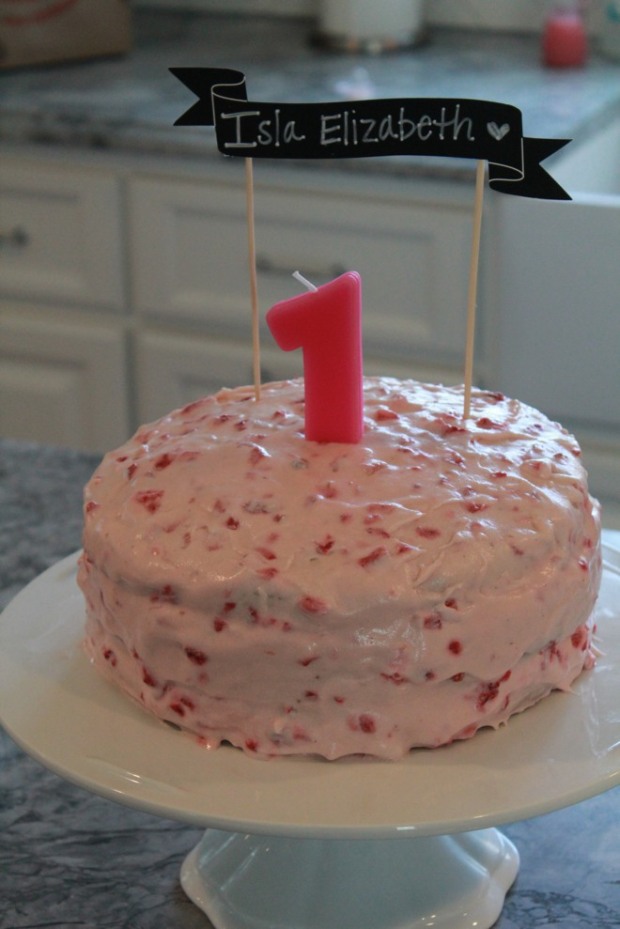 Pink strawberry first birthday cake